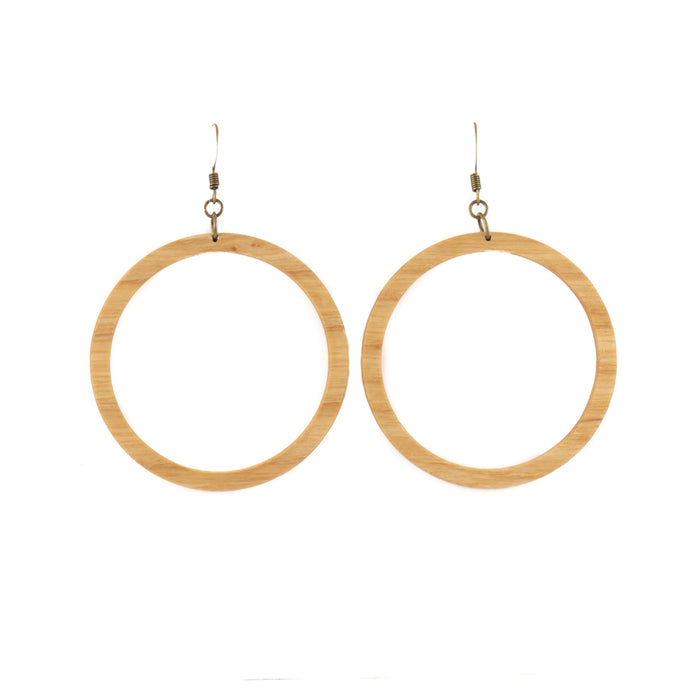 These smoothed wooden earrings feature a large singular hoop. Available in red oak, cherry, walnut, or ash.  Each piece is handmade and unique. Placement and colors may vary and are not guaranteed but will resemble the piece shown.      2" long x 2" wide     Ear hook is bronze and nickle free.