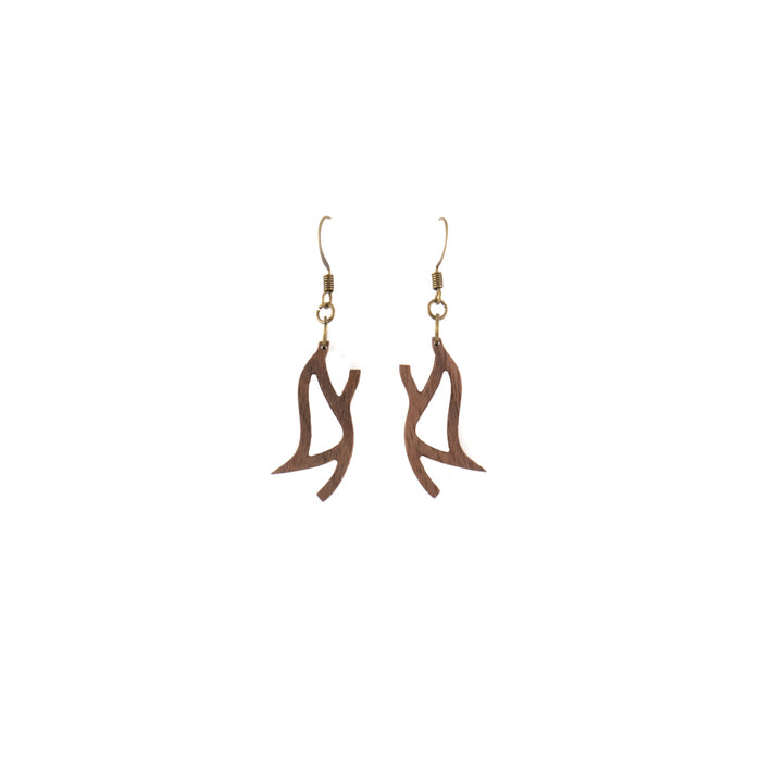 A pair of smoothed wooden drop earrings features a fluid abstract design. Available in walnut or red oak.  Each piece is handmade and unique. Placement and colors may vary and are not guaranteed but will resemble the piece shown.      1" long x 0.5" wide     Ear hook is bronze and nickle free.